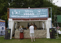 Food, Catering, Vegan food stall at outdoor festival.
