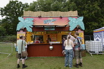 Food, Catering, Vegan food stall at outdoor festival.