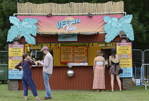 Food, Catering, Vegan food stall at outdoor festival.