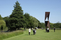 England, East Sussex, Glyndebourne, Opera goers relaxing on the lawns.