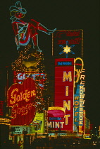 USA, Nevada, Las Vegas Downtown, Fremont Street before the roof was added, Neon casino and hotel signs illuminated at night.