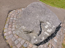 Ireland, County Down, Downpatrick, Mourne granite slab marking the traditional burial place of St Patrick at the Cathedral Church of the Holy Trinity also known as Down Cathedral.