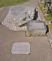 Ireland, County Down, Downpatrick, Mourne granite slab marking the traditional burial place of St Patrick at the Cathedral Church of the Holy Trinity also known as Down Cathedral.