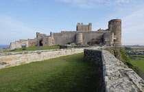 England, Northumberland, Bamburgh Castle on rocky outcrop.