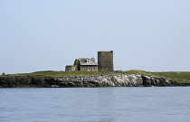 England, Northumberland, Farne Island, Brownsman Island, Darling Home, Cottage was the former home of the Darling family. Base of 1800's abandoned lighthouse to the left side of the cottage. Older bea...