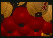 Japan, Detail of Red and White illuminated Paper Lanterns.