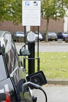 Transport, Cars, Electric, Vehicle plugged into recharge point.