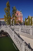 Slovenia, Ljubljana, Preseren Square, The Triple Bridge with the facade of the Franciscan Church of the Annunciation in the background.