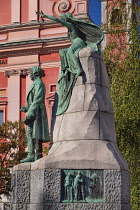 Slovenia, Ljubljana, Preseren Square, Preseren Monument in honour of Slovenia's greatest poet with the facade of the Franciscan Church of the Annunciation in the background.