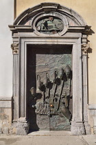 Slovenia, Ljubljana, Side entrance door of the Cathedral of St Nicholas, also known as the Ljubljana Door which is decorated with portraits of 20th century bishops of Ljubljana.