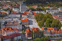 Slovenia, Ljubljana, Ursuline Church of the Holy Trinity in Kongresni Trg or Congress Square seen from Ljubljana Castle.