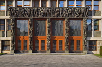 Slovenia, Ljubljana, Slovenian Parliament Building, Main entrance portal with four oak doors surrounded with statues by Zdenko Kalin and Karel Putrih which represent working people and aspects of thei...