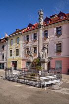 Slovenia, Upper Carniola, Skofja Loka, Mestni trg Square, Plague Column from 1751 with St Roch, Virgin Mary with infant Jesus  and St Anthony.