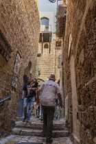 Israel, Jaffa, Old Jaffa, Visitors walk through the narrow alleyways.