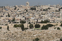 Israel, Jerusalem, Mount of Olives, The Muslim cemetery outside the city walls with the Muslim Quarter in the Old City of Jerusalem as viewed from the Mount of Olives. At upper left is the Christian Q...