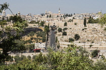 Israel, Jerusalem, Mount of Olives, The Lions' Gate or St. Stephen's Gate into the Muslim Quarter in the Old City of Jerusalem. At right is a Muslim cemetery outside the city walls. The Old City of Je...