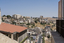 Palestine, Bethlehem, The modern city of Bethlehem in the Occupied West Bank, with the large Catholic Action Sports Center on the hill top..