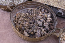 Jordan, Petra, Black Hojari frankincense olibanum resin incense for sale. Petra Archeological Park is a Jordanian National Park and a UNESCO World Heritage Site.