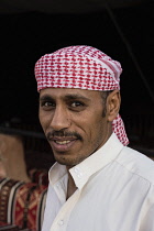 Jordan, Wadi Rum Protected Area, A Bedouin man in the traditional keffiyeh or head scarf in the Wadi Rum Protected Area, a UNESCO World Heritage Site.