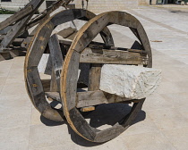 Israel, Jerusalem, Jerusalem Archeological Park, A set of wooden wheels used the Metagenes method to move heavy blocks of stone in construction projects in ancient Jerusalem. The Old City of Jerusalem...