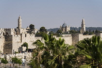 Israel, Jerusalem, Armenian Quarter, The city wall of Jerusalem with the minaret of the Tower of David or the Citadel in the foreground. Behind is the bell tower and church of the Dormition Abbey on M...