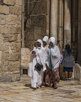 Israel, Jerusalem, Ethiopian Christian pilgrims visiting the Church of the Holy Sepulchre in the Christian Quarter. The Old City of Jerusalem and its Walls is a UNESCO World Heritage Site. This church...