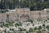 Israel, Jerusalem, Mount of Olives, The Eastern Gate, the Golden Gate or the Gate of Mercy of the Old City with the Temple Mount or al-Haram ash-Sharif behind it. In front is a Muslim cemetery. The Ol...