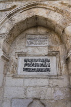 Israel, Jerusalem, Arabic script marking the site of an ancient fountain in the Muslim Quarter of the Old City. The Old City of Jerusalem and its Walls is a UNESCO World Heritage Site.