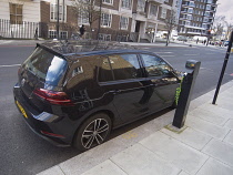 England, London, Westminster, Marylebone, Electric Volkswagen Golf being being charged on Gloucester Place.