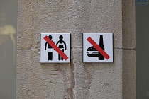 Spain, Catalonia, Barcelona, Inappropriate dress, food and drink prohibited, street signs.