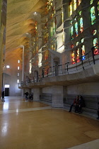 Spain, Catalonia, Barcelona, Interior of the Sagrada Familia designed by Antoni Gaudi, Nave, Passion side, Joan Vila-Grau designed stained glass .