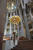 Spain, Catalonia, Barcelona, Interior of the Sagrada Familia designed by Antoni Gaudi, Apse, Altar, Baldachin canopy.