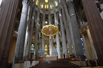 Spain, Catalonia, Barcelona, Interior of the Sagrada Familia designed by Antoni Gaudi, Apse, Altar, Baldachin canopy.