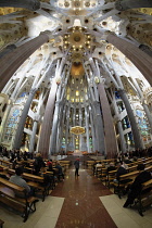 Spain, Catalonia, Barcelona, Interior of the Sagrada Familia designed by Antoni Gaudi, Apse, Altar, Baldachin canopy.