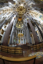 Spain, Catalonia, Barcelona, Interior of the Sagrada Familia designed by Antoni Gaudi, Apse, Altar, Baldachin canopy.