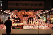 Spain, Catalonia, Barcelona, Market Sant Josep Boqueria, The Home of the Ham stall selling cured meats.