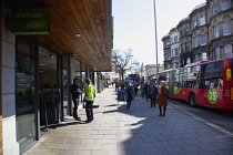 England, East Sussex, Brighton, People in queue with social distancing measures put in place by Waitrose supermarket to limit people entering the store.