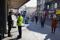 England, East Sussex, Brighton, People in queue with social distancing measures put in place by Waitrose supermarket to limit people entering the store.