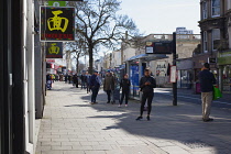 England, East Sussex, Brighton, People in queue with social distancing measures put in place by Waitrose supermarket to limit people entering the store.