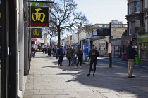 England, East Sussex, Brighton, People in queue with social distancing measures put in place by Waitrose supermarket to limit people entering the store.