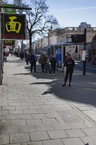 England, East Sussex, Brighton, People in queue with social distancing measures put in place by Waitrose supermarket to limit people entering the store.