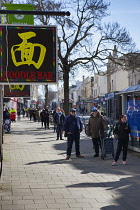 England, East Sussex, Brighton, People in queue with social distancing measures put in place by Waitrose supermarket to limit people entering the store.