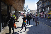 England, East Sussex, Brighton, People in queue with social distancing measures put in place by Waitrose supermarket to limit people entering the store.