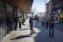 England, East Sussex, Brighton, People in queue with social distancing measures put in place by Waitrose supermarket to limit people entering the store.