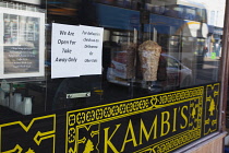 England, East Sussex, Brighton, Kambi's Lebanese restaurant sign showing delivery only service during Coronavirus emergency measures.
