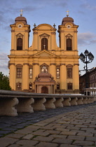 Romania, Timis, Timisoara, Catholic cathedral on Piata Unirii with seating, old town.