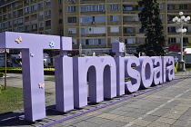 Romania, Timis, Timisoara, sign and gardens, Piata Victoriei, old town.