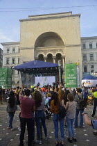 Romania, Timis, Timisoara, Crowd and live music performance in front of Opera House/National Theatrei, Piata Victoriei , old town.