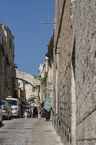 Israel, Jerusalem, Lions' Gate Street in the Muslim Quarter of the Old City of Jerusalem. The Old City and its Walls is a UNESCO World Heritage Site. The Ecce Homo Arch, with the window, is visible ov...