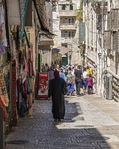 Israel, Jerusalem, A Muslim woman in traditional dress in the Muslim Quarter of the Old City. The Old City of Jerusalem and its Walls is a UNESCO World Heritage Site.